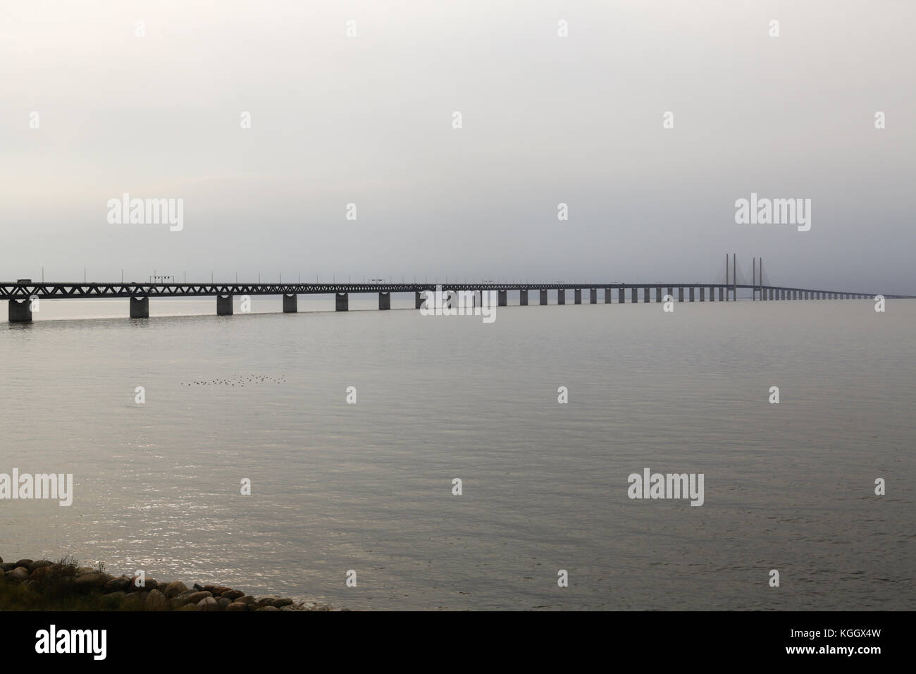 The Oresund Bridge connects Sweden and Denmark and is a combined twin-track railroad and four-lane highway bridge-tunnel across the Oresund strait. Stock Photo