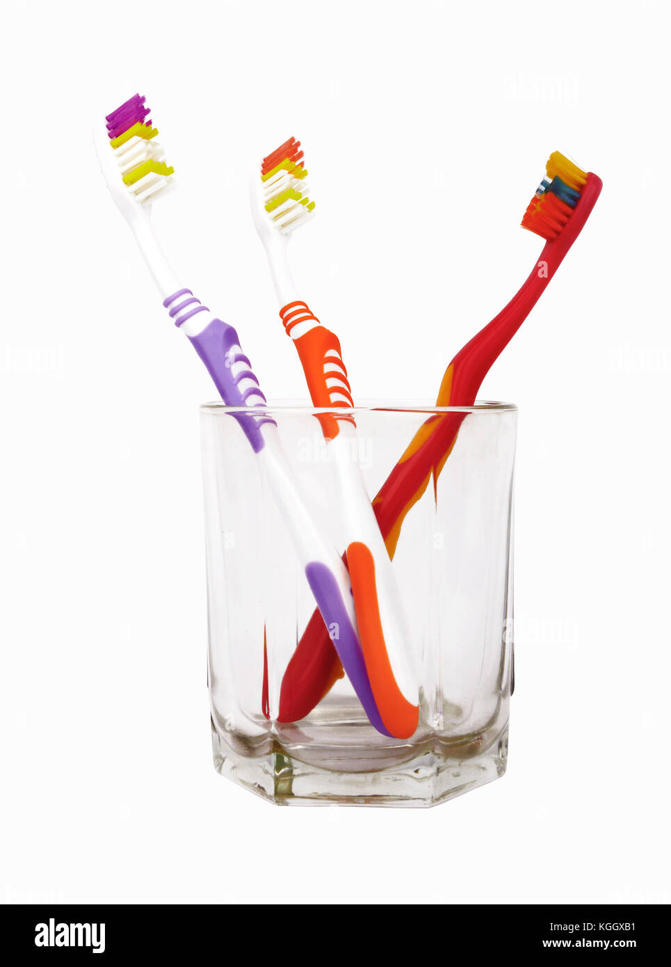 Toothbrushes in glass isolated on white Stock Photo - Alamy