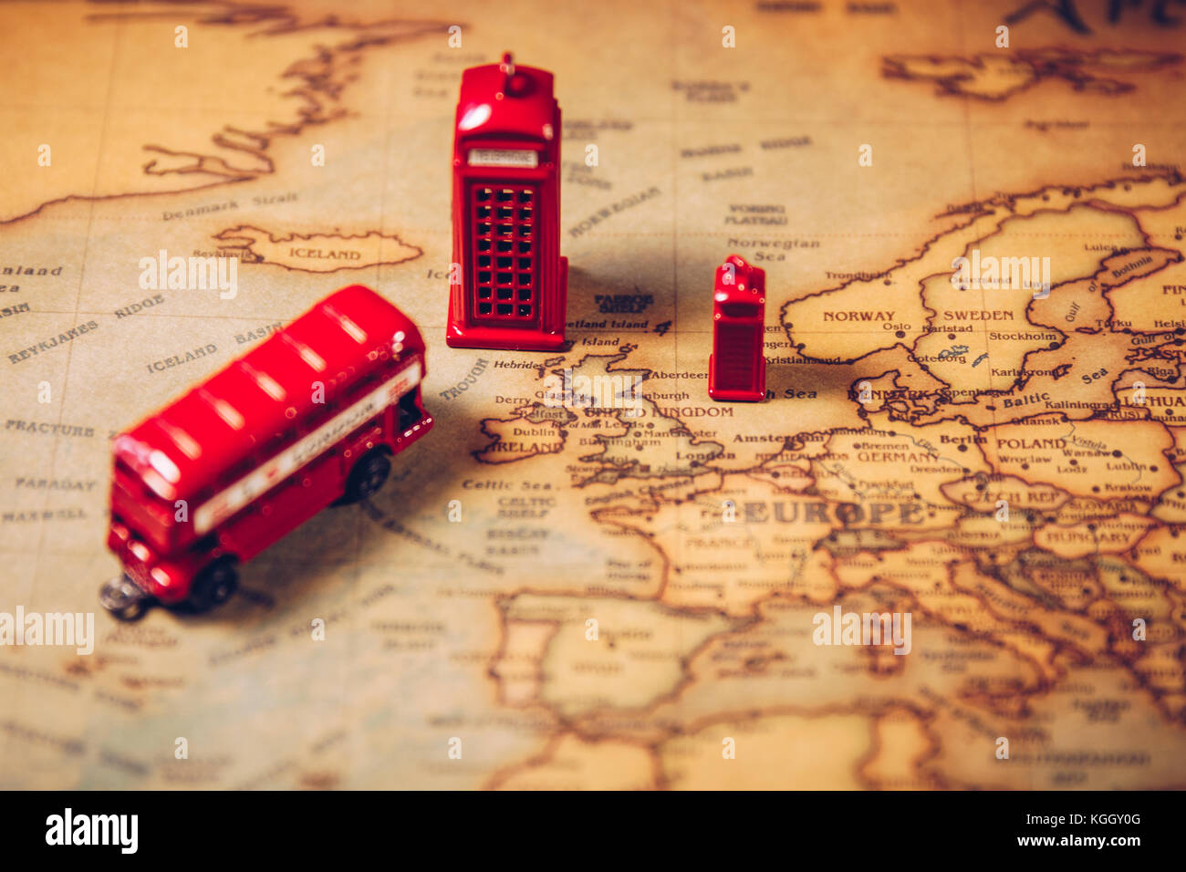 The iconic red bus and Big Ben miniature with compass on the map of London, UK. Concept of travel. Stock Photo