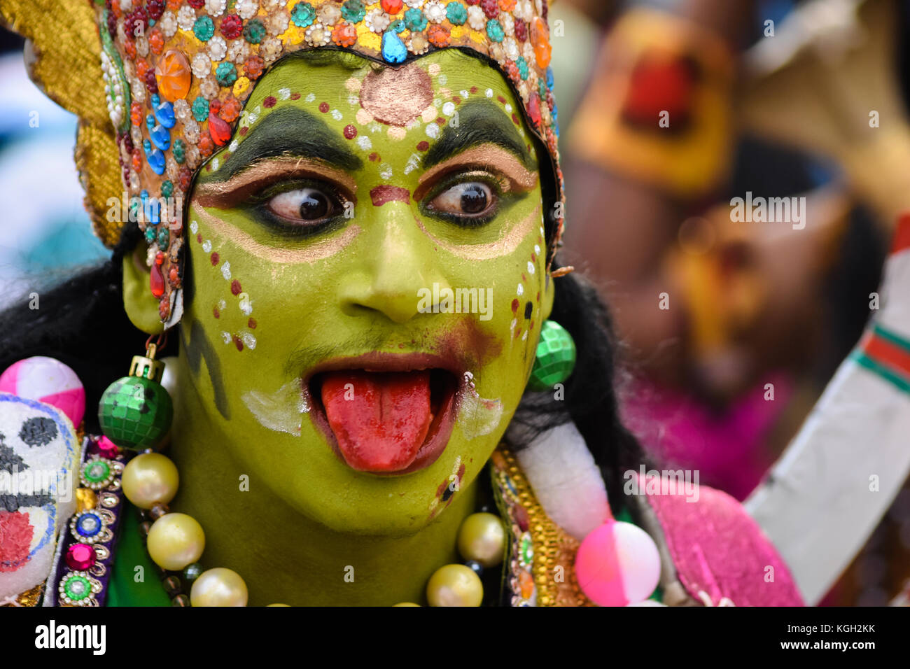 A man in a traditional costume at an Indian religious music festival in