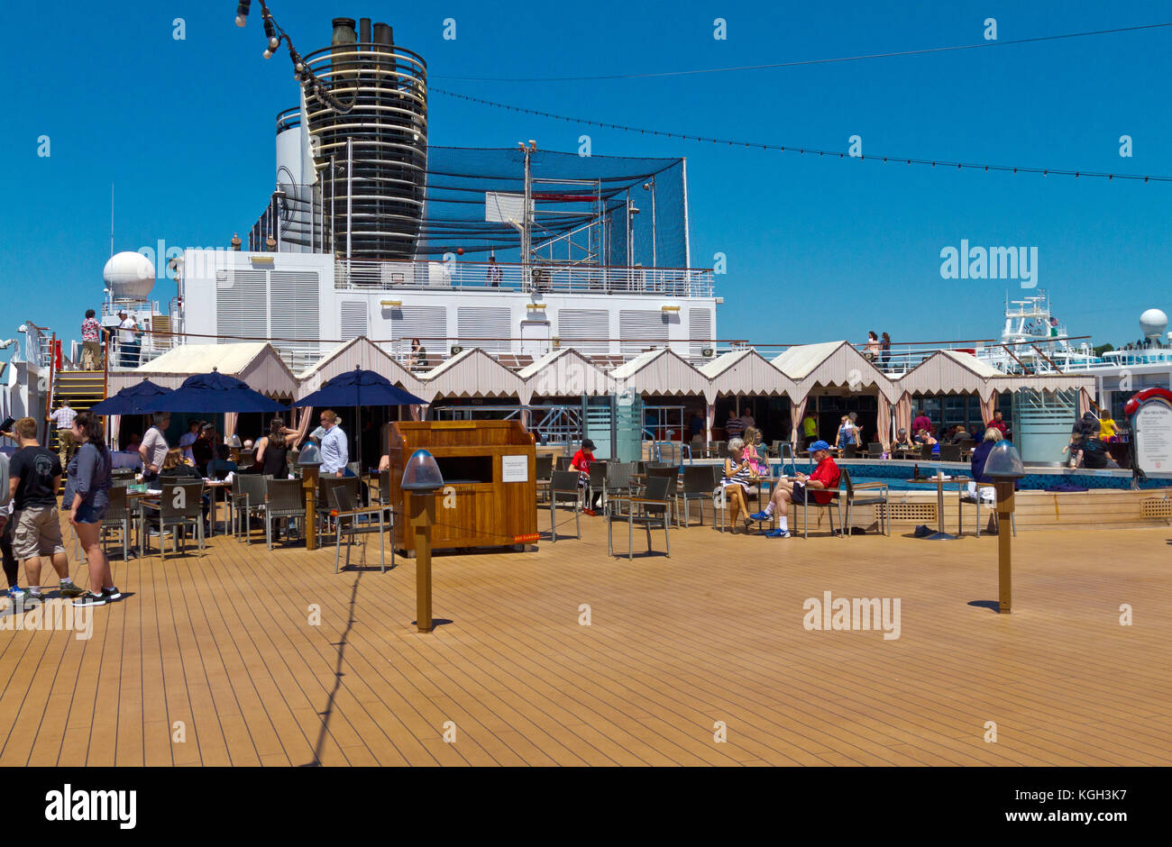 People on a cruise relaxing on the aft deck on the ship Eurodam