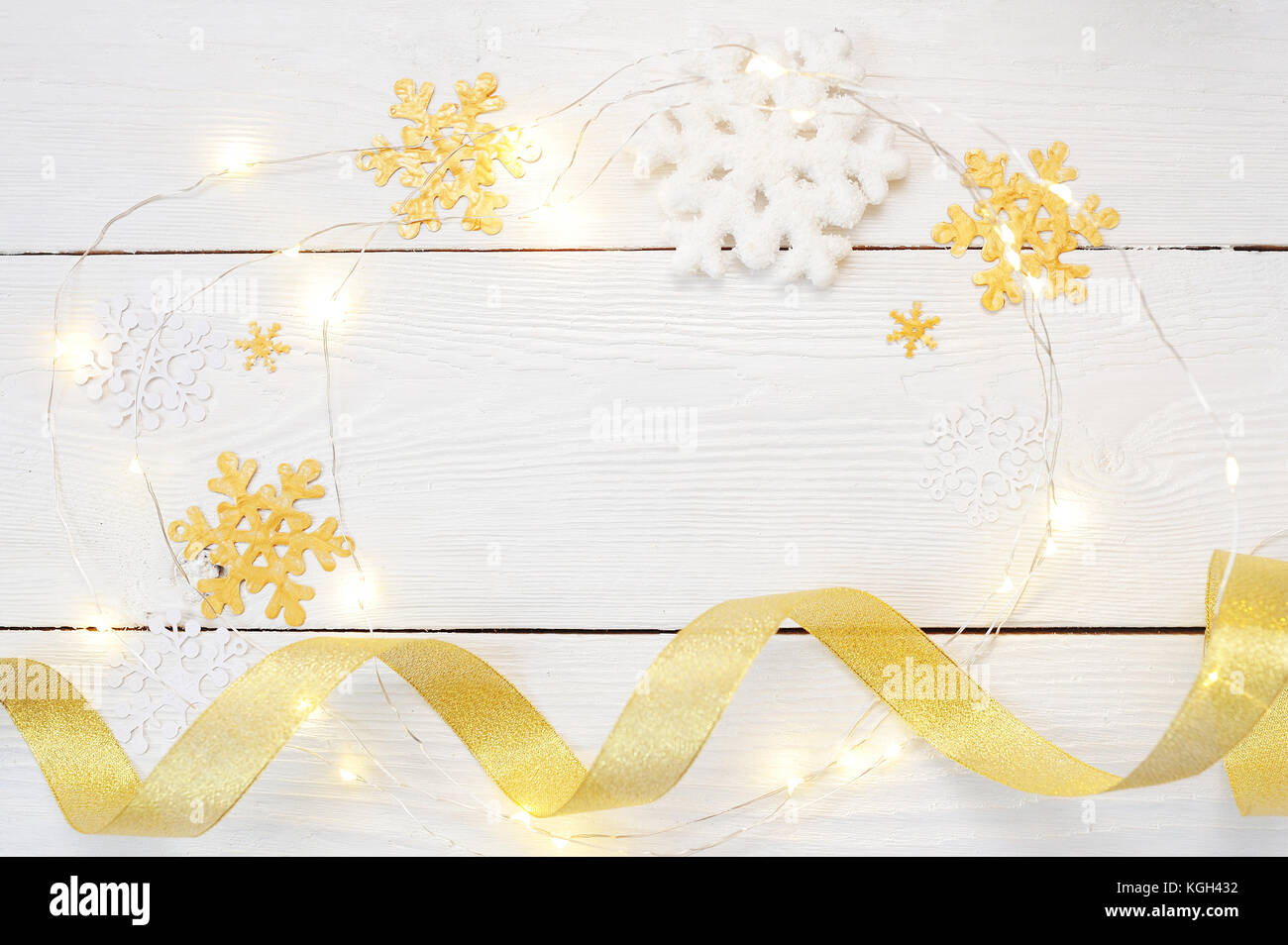 christmas or new year composition. christmas gifts and decorations in gold colors on white background. holiday and celebration concept for postcard or invitation. flat lay. top view Stock Photo
