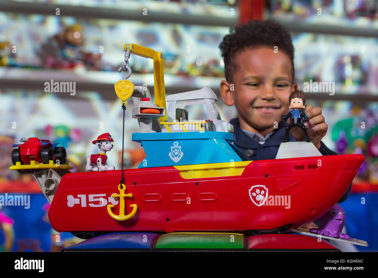 Philip Kamau, 7, plays the Paw Patrol Sea Patroller during the unveiling of the annual DreamToys list compiled by an independent panel of retailers which predicts the top Christmas toys