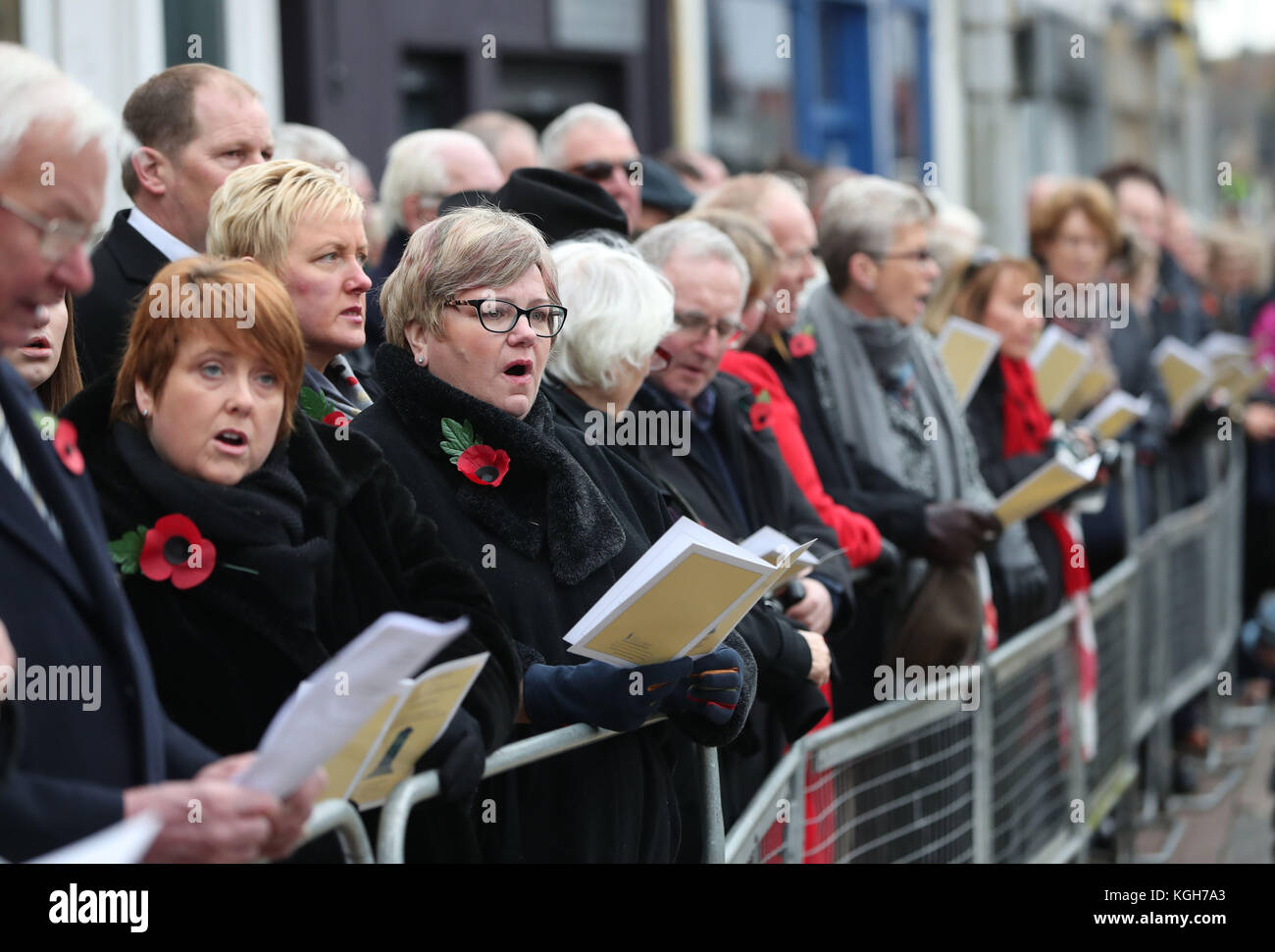 Crowds line the streets during the unveiling of a new memorial to the 12 victims of the IRA's 1987 Remembrance Sunday bomb attack in Enniskillen, Co Fermanagh. Stock Photo