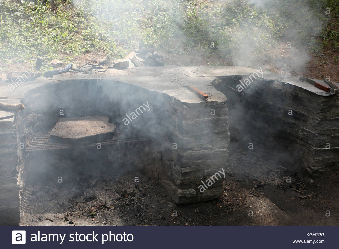 Outdoor Traditional Italian Alps Stone Fireplace Stock Photo