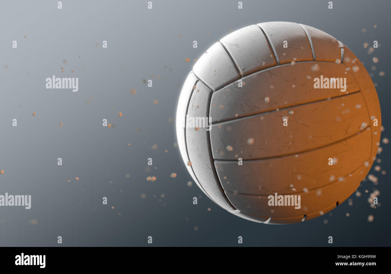 A dirty white volleyball caught in slow motion flying through the air scattering sand particles in its wake - 3D render Stock Photo