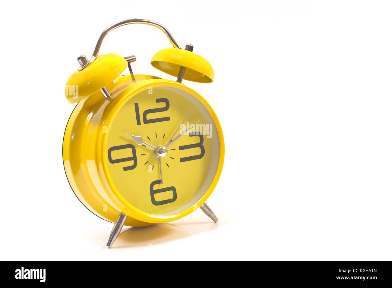 Yellow alarm clock isolated on white Stock Photo Alamy