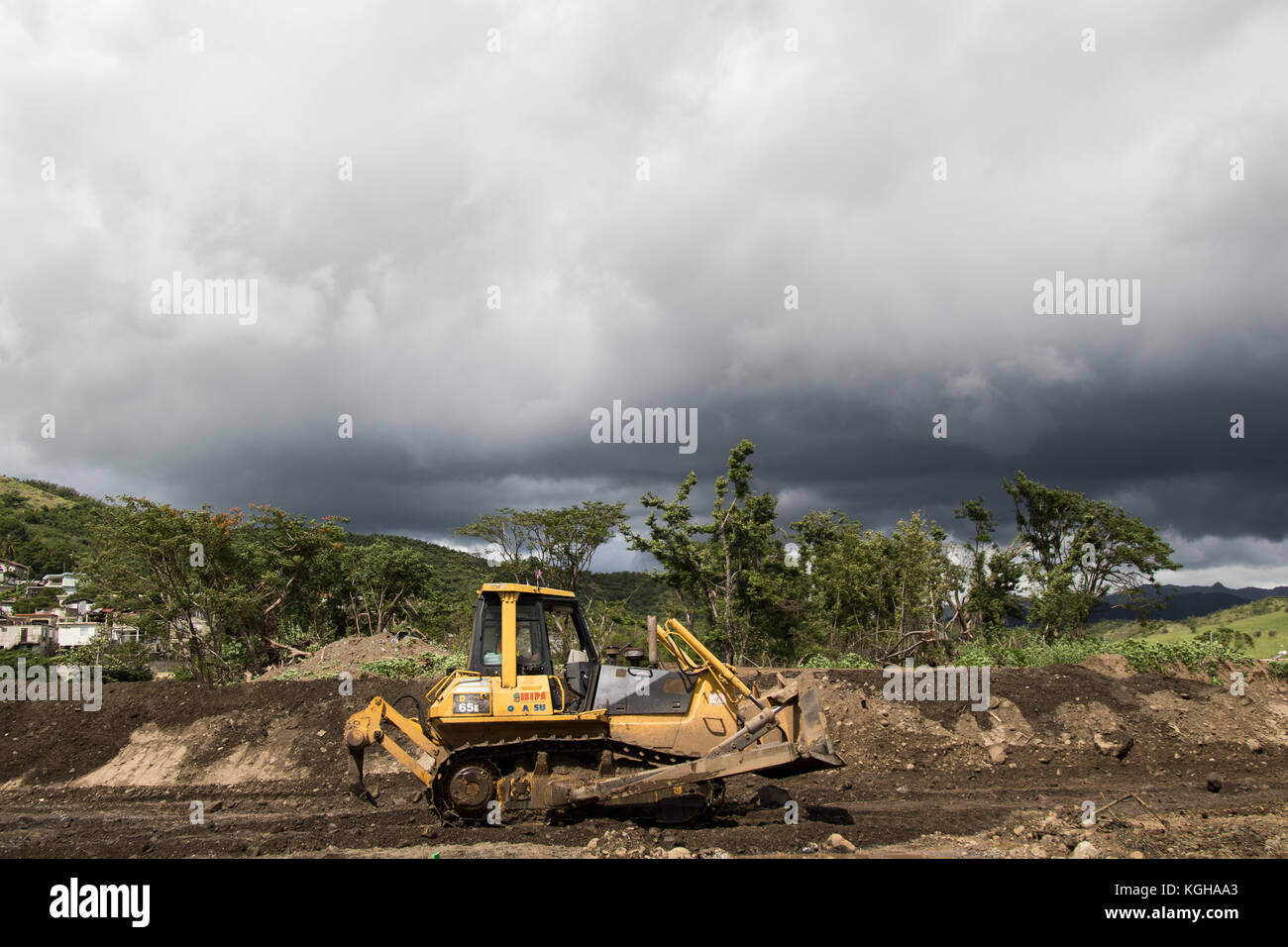 Earthmoving equipment sits staged for use during an emergency levee construction project undertaken by the Army Corps of Enginee Stock Photo