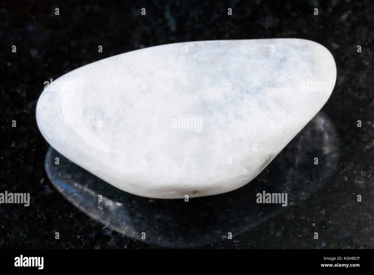 macro shooting of natural mineral rock specimen - pebble of white ...
