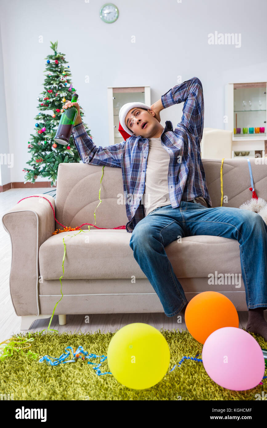 Man having hangover after christmas party Stock Photo Alamy