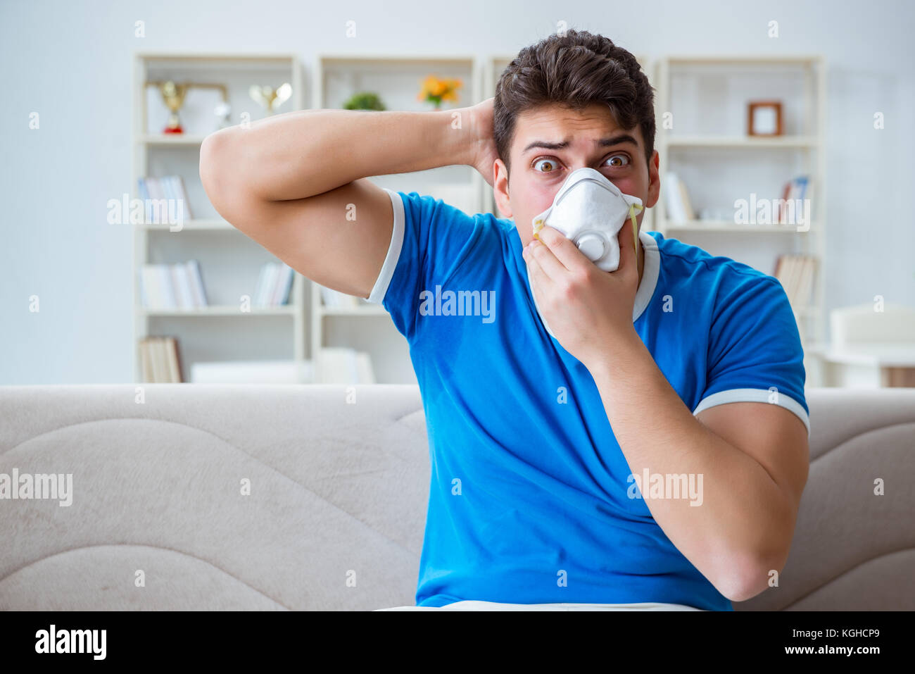 Man sweating excessively smelling bad at home Stock Photo Alamy