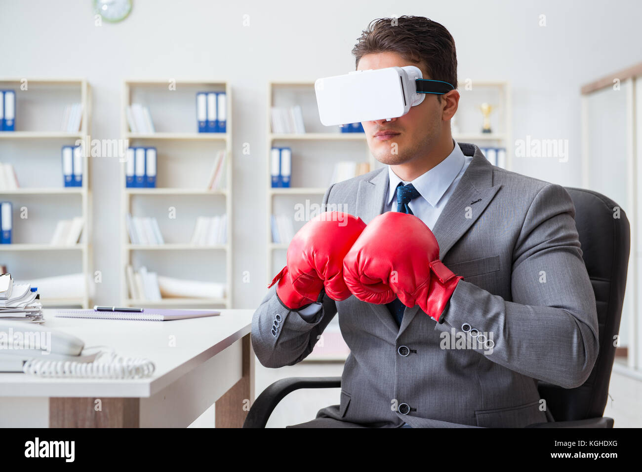Man boxing in the office with virtual reality goggles Stock Photo Alamy