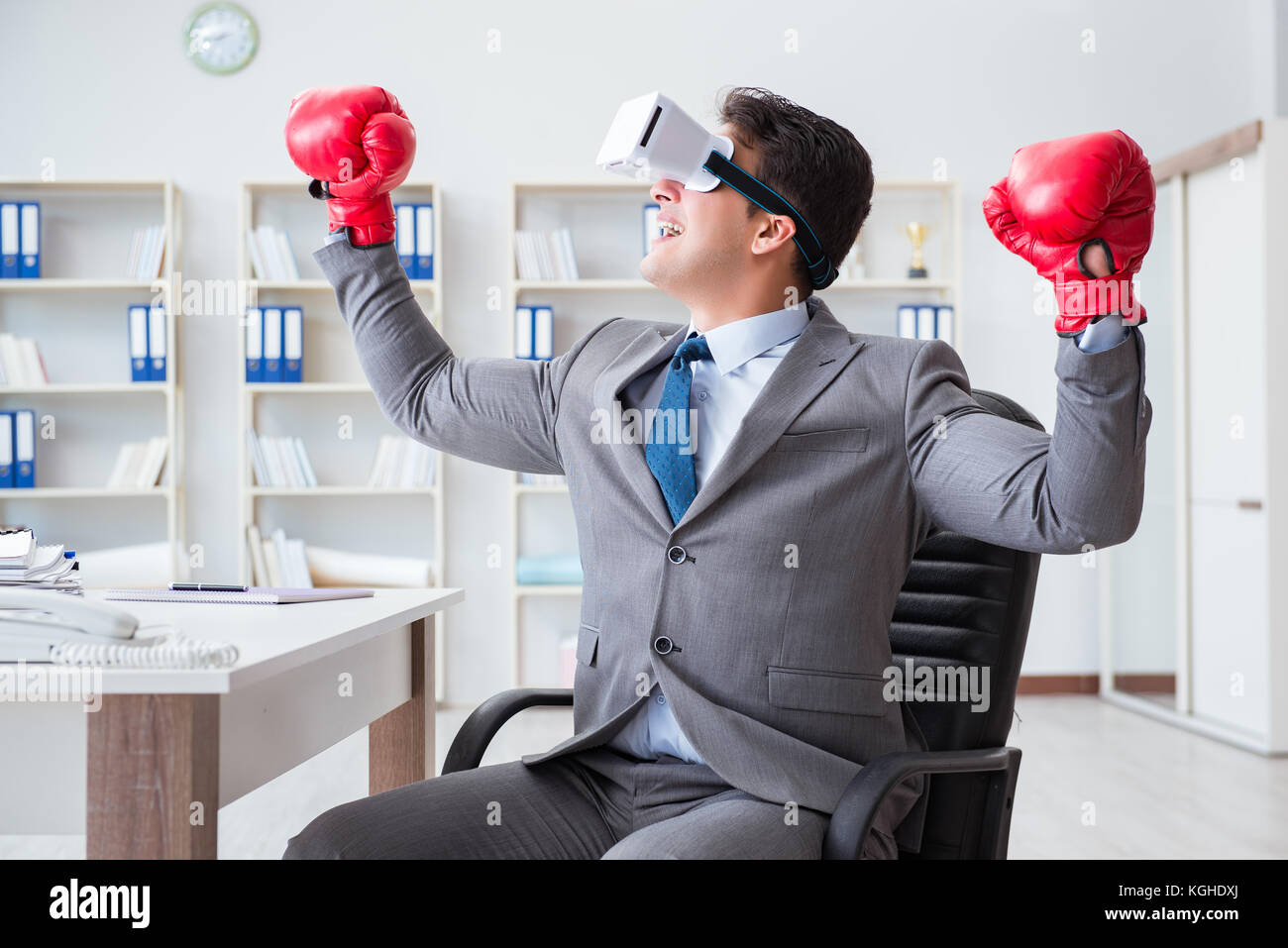 Man boxing in the office with virtual reality goggles Stock Photo Alamy