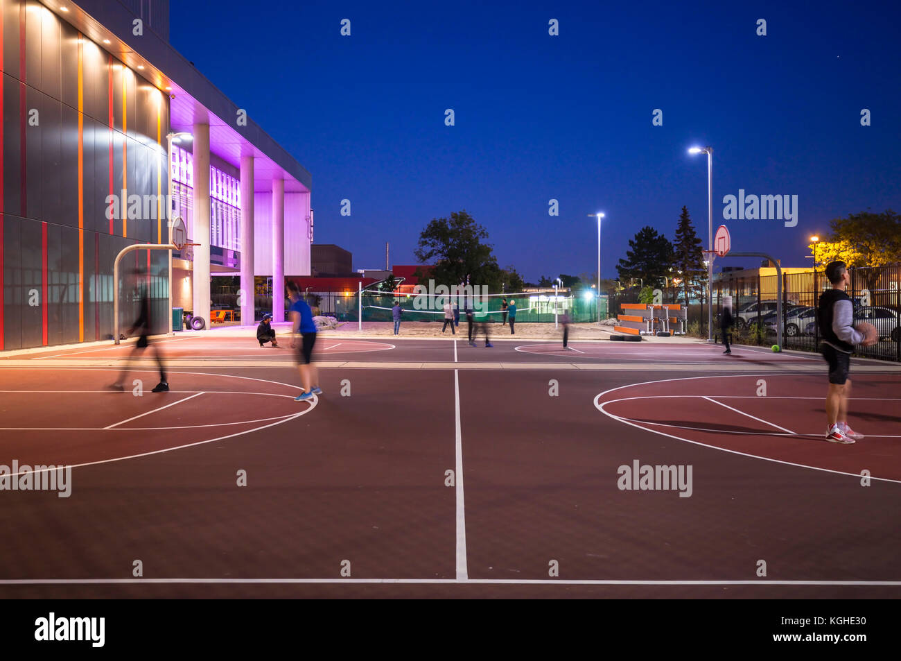 Students playing basketball and volleyball on their respective courts in front of Mohawk College's Fennel Campus in Hamilton, Ontario, Canada. Stock Photo