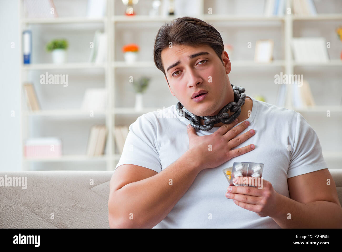 Young man suffering from sore throat Stock Photo Alamy