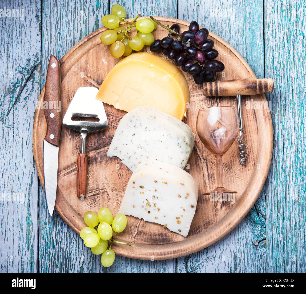 aromatic Swiss cheese and glass of grape wine Stock Photo Alamy