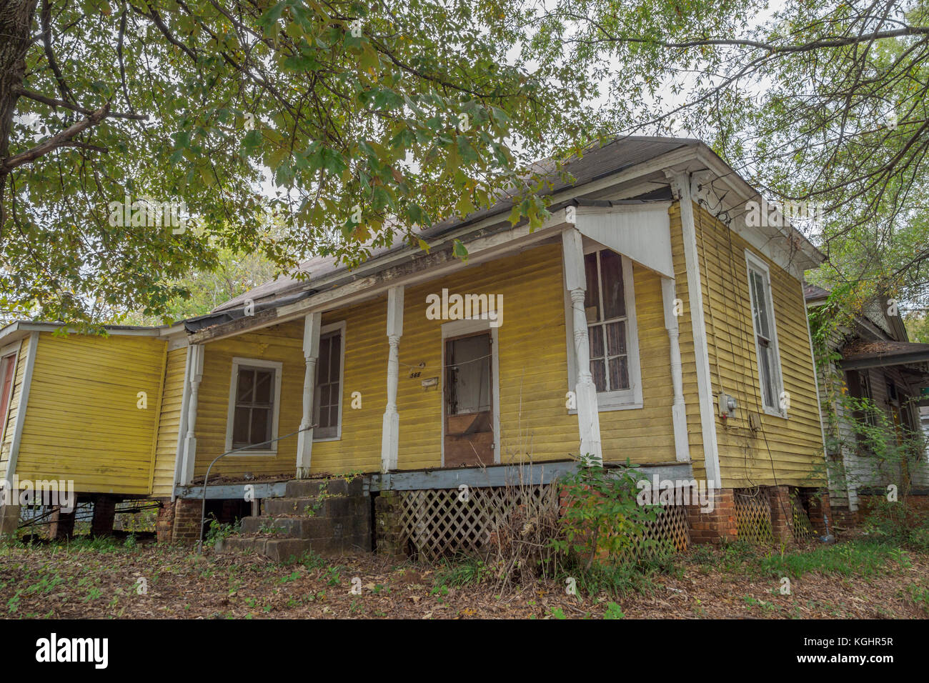 Boarded up, abandoned, house in urban decline, decay, blight, and American poverty in Montgomery, Alabama USA. Stock Photo