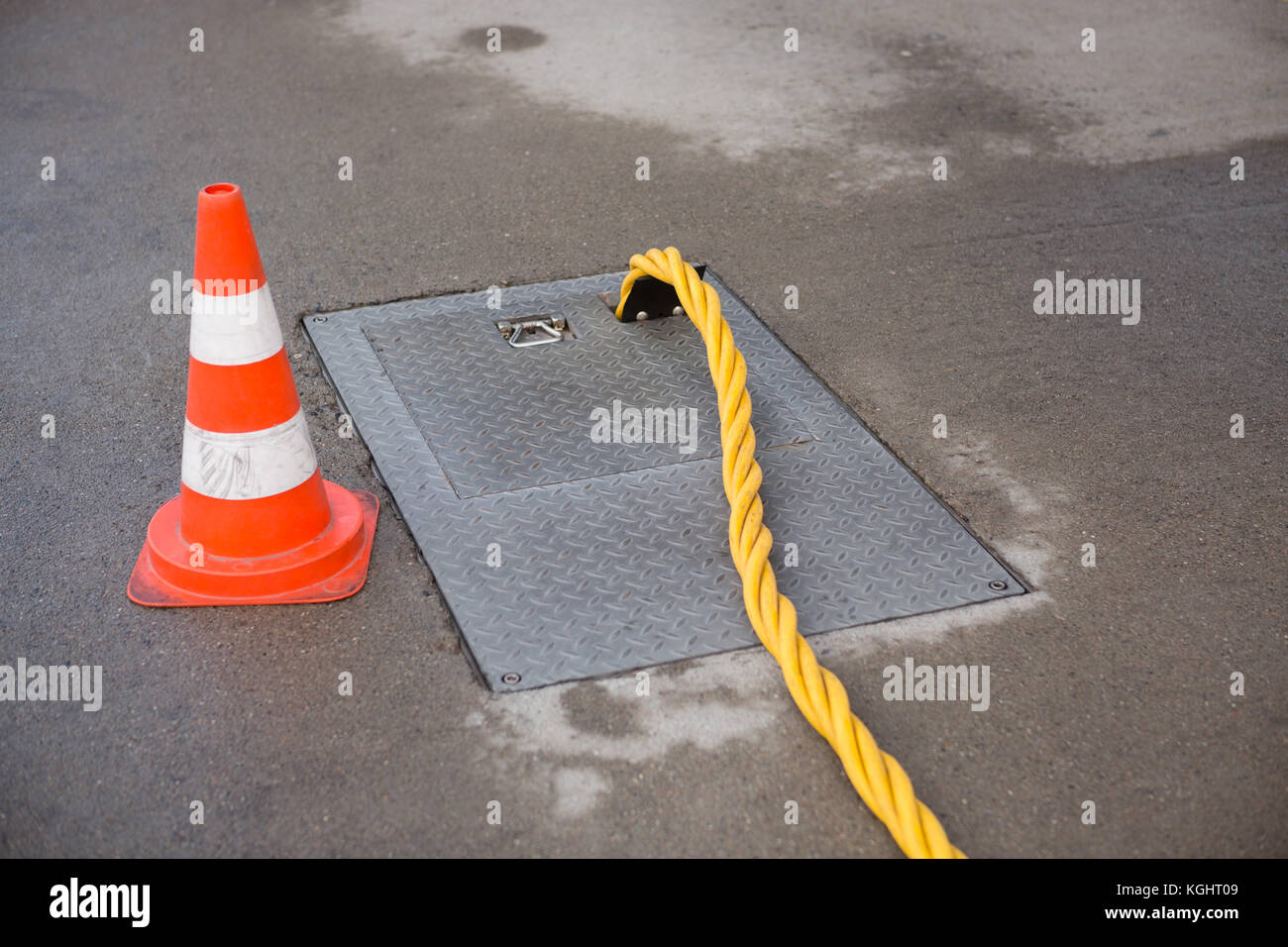 Ground Power Pipe And Traffic Cone At Airport Stock Photo