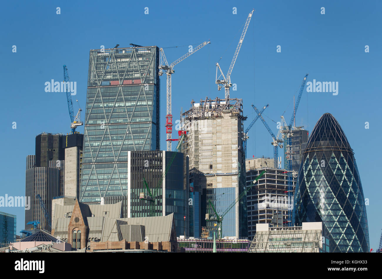 London city skyline seen from the river thames as cranes work on new buildings in the square mile Stock Photo