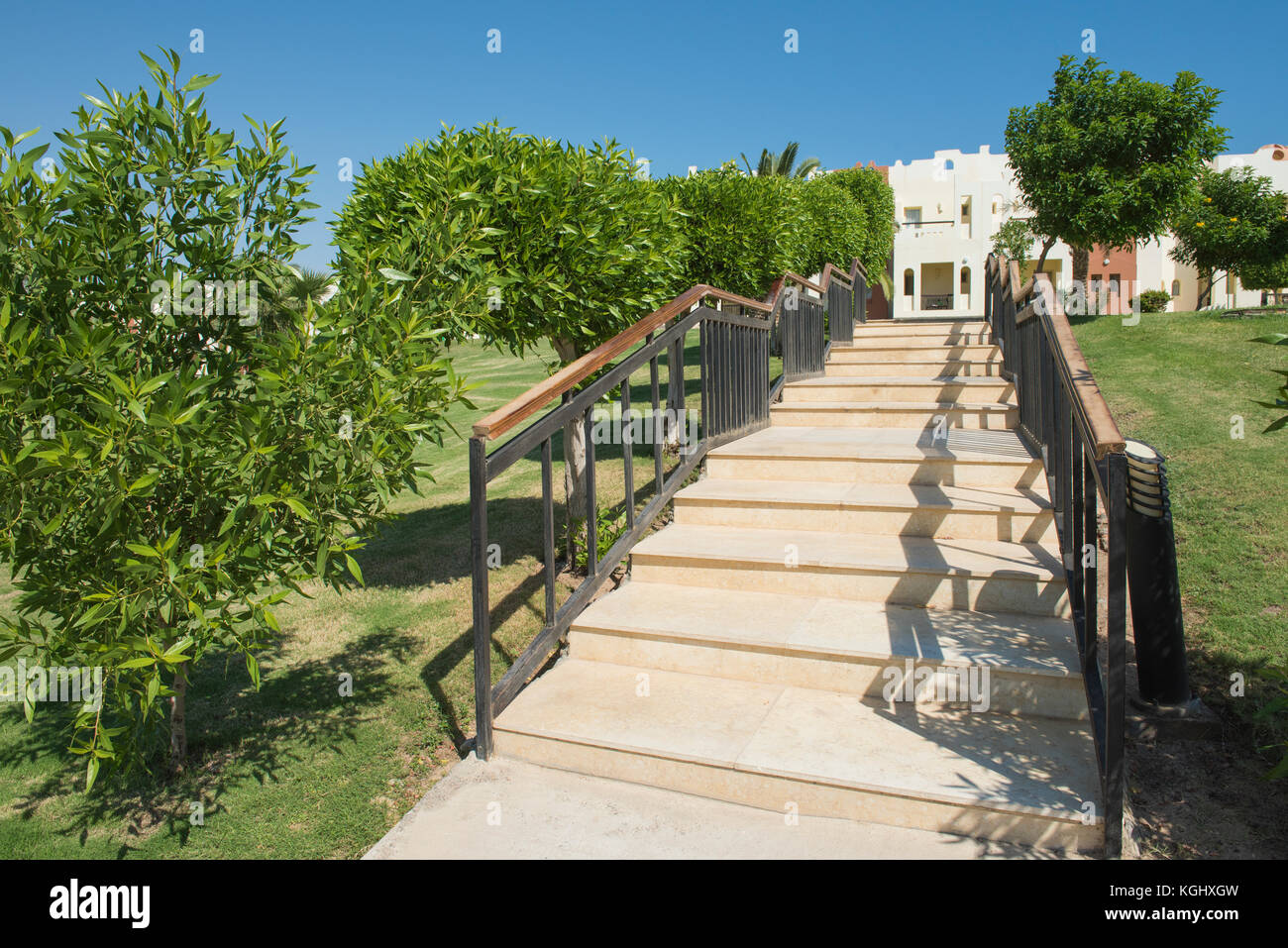 Formal landscaped gardens with steps staircase in grounds of a luxury tropical hotel resort Stock Photo