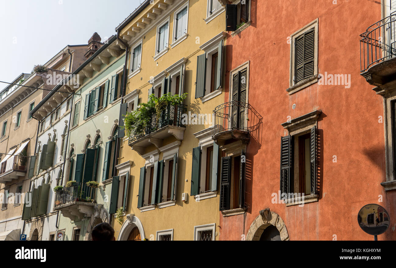Street with pretty, beautiful, houses in Verona with balconies and