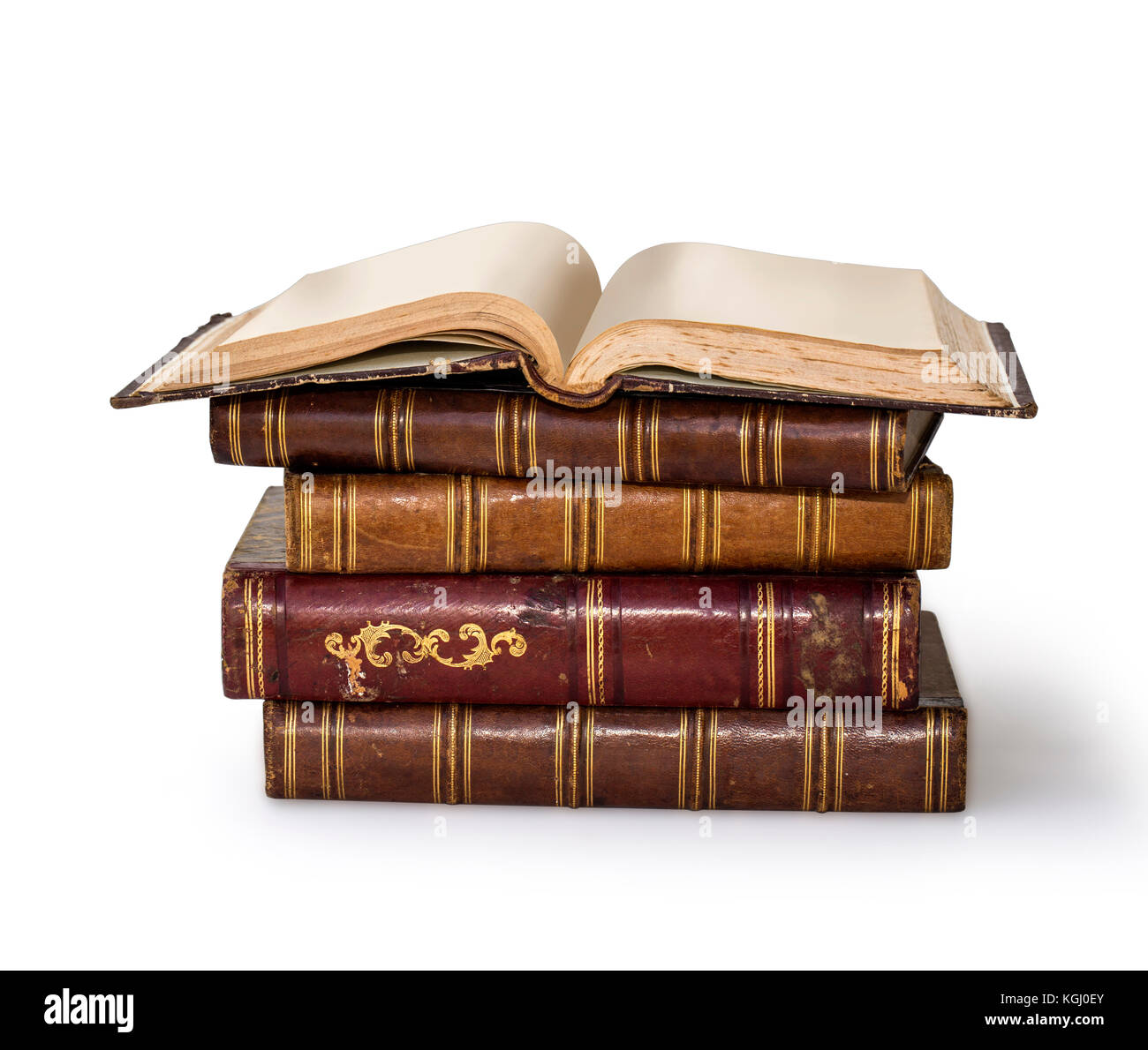 Old books piled together over white background with clipping path Stock Photo