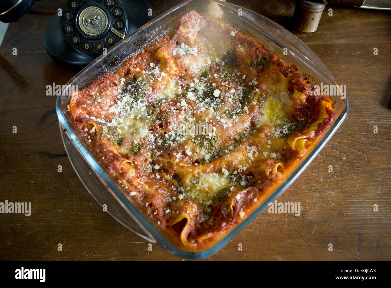 lasagne at pesto and tomatosauce cooked in glass pyrex dish Stock Photo -  Alamy