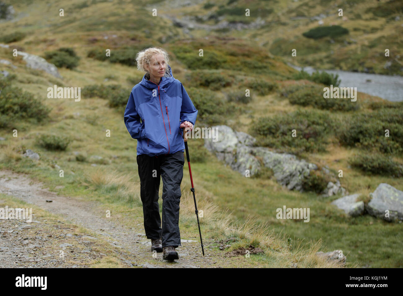 A woman hiking in the Austrian Mountains Stock Photo - Alamy