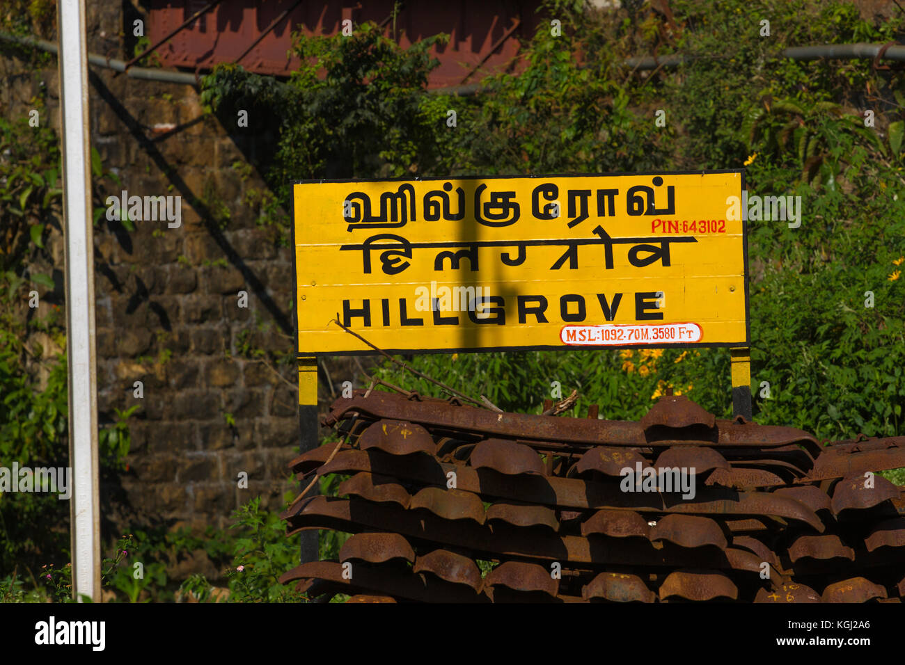 Railroad sign Hillgrove written in Tamil official language of Tamilnadu