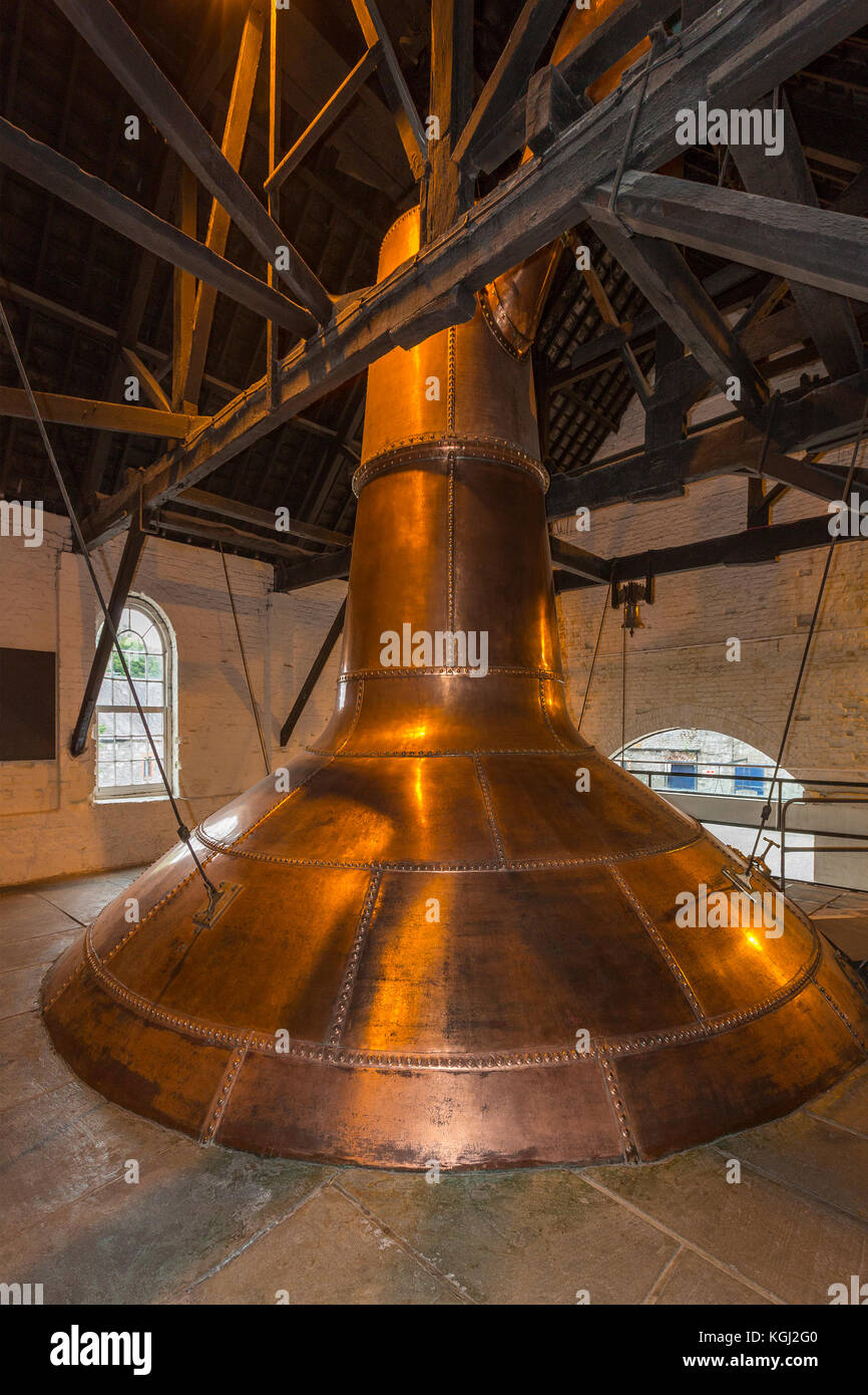 An Irish copper pot still used in the production of Irish whisky. A still is an apparatus used to distill fermented grain mash by heating to selective Stock Photo