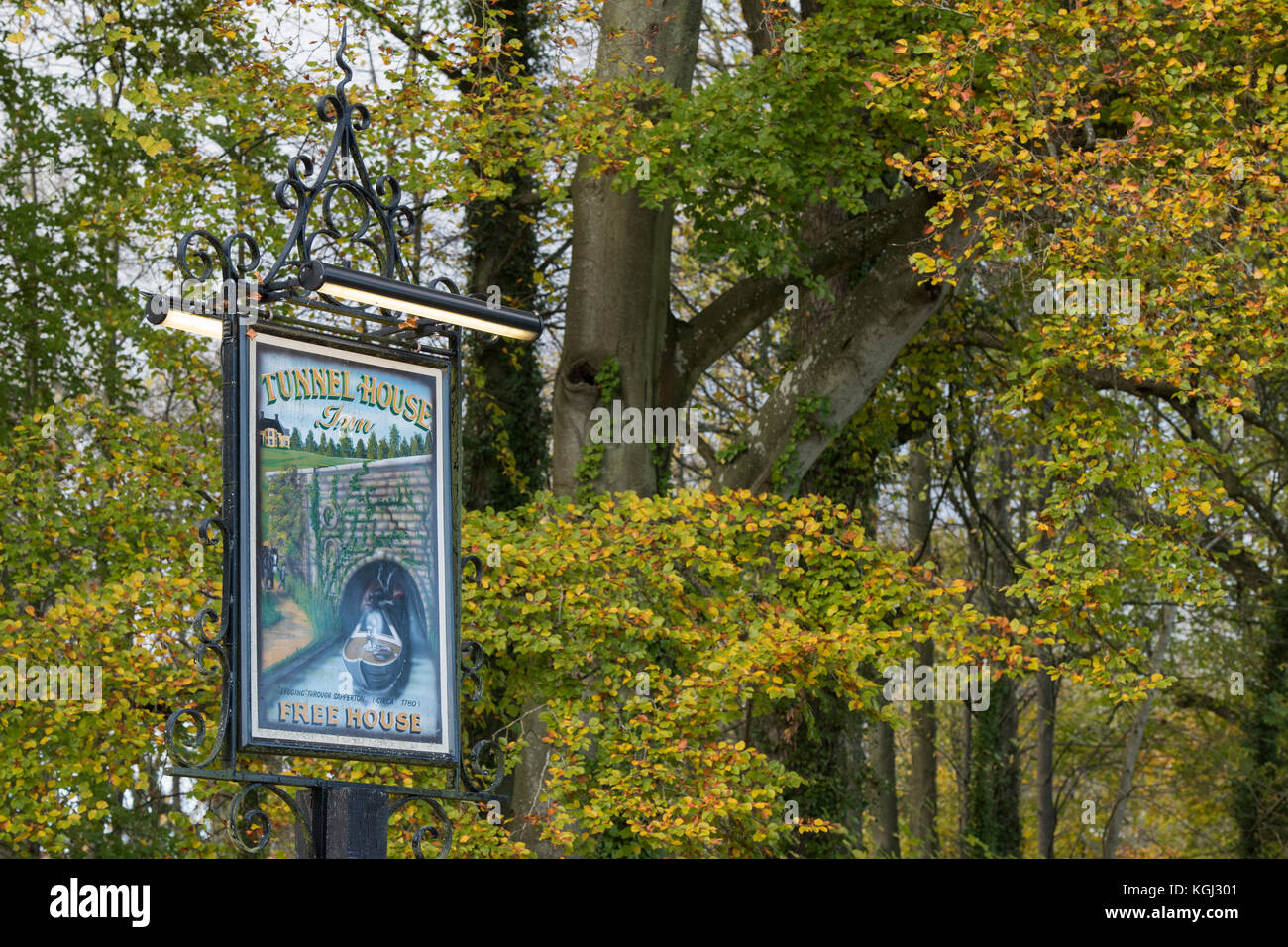 The Tunnel Inn pub sign next to Sapperton Canal Tunnel in autumn. Coates, Cirencester, Gloucestershire, UK Stock Photo