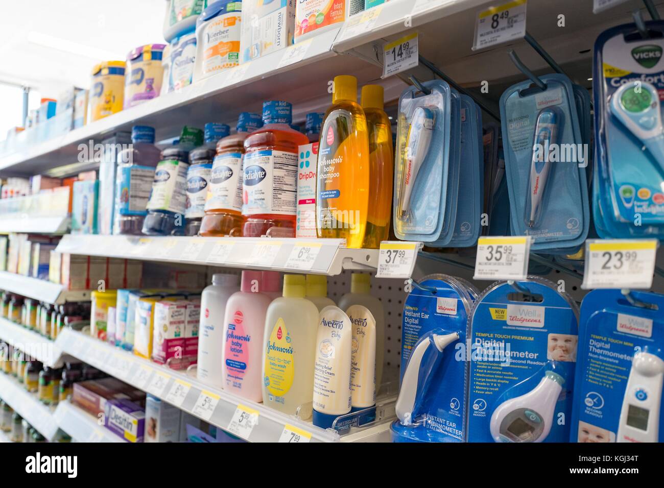 Infant and baby care products, including Johnson's products, Pedialyte, and several digital thermometers are visible on the shelves of a pharmacy in San Francisco, California, September 29, 2017. () Stock Photo