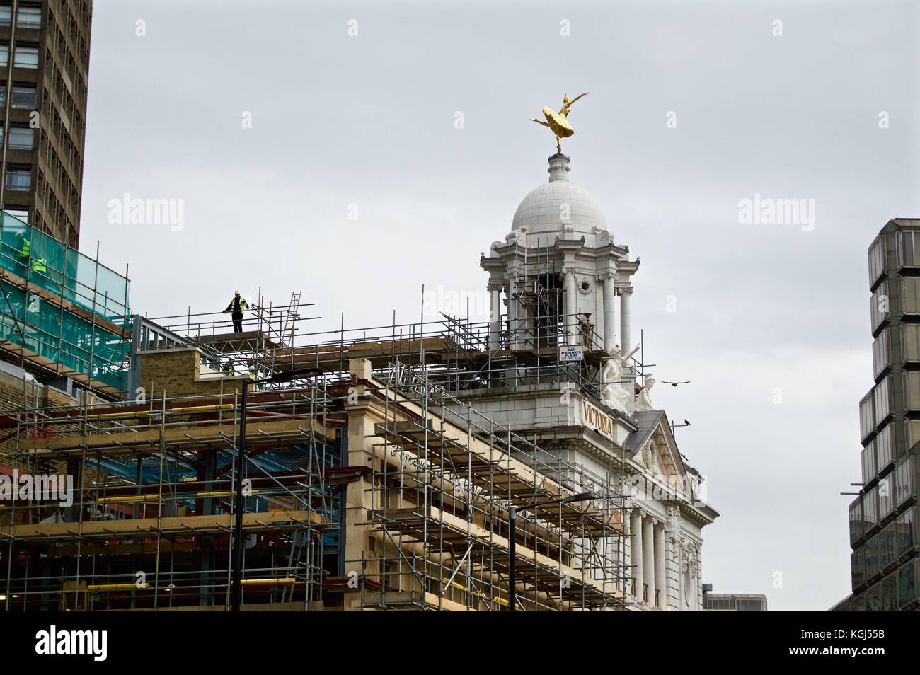 Victoria Palace Theatre undergoing external restoration work with scaffolding on one side, Victoria, London, UK Stock Photo