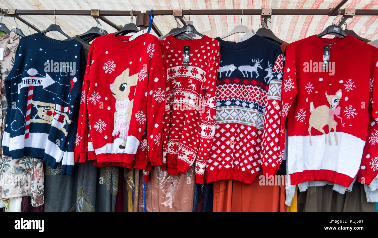 Market stall Christmas novelty sale  knitted jumpers with rabbit and reindeer patterns Stock Photo