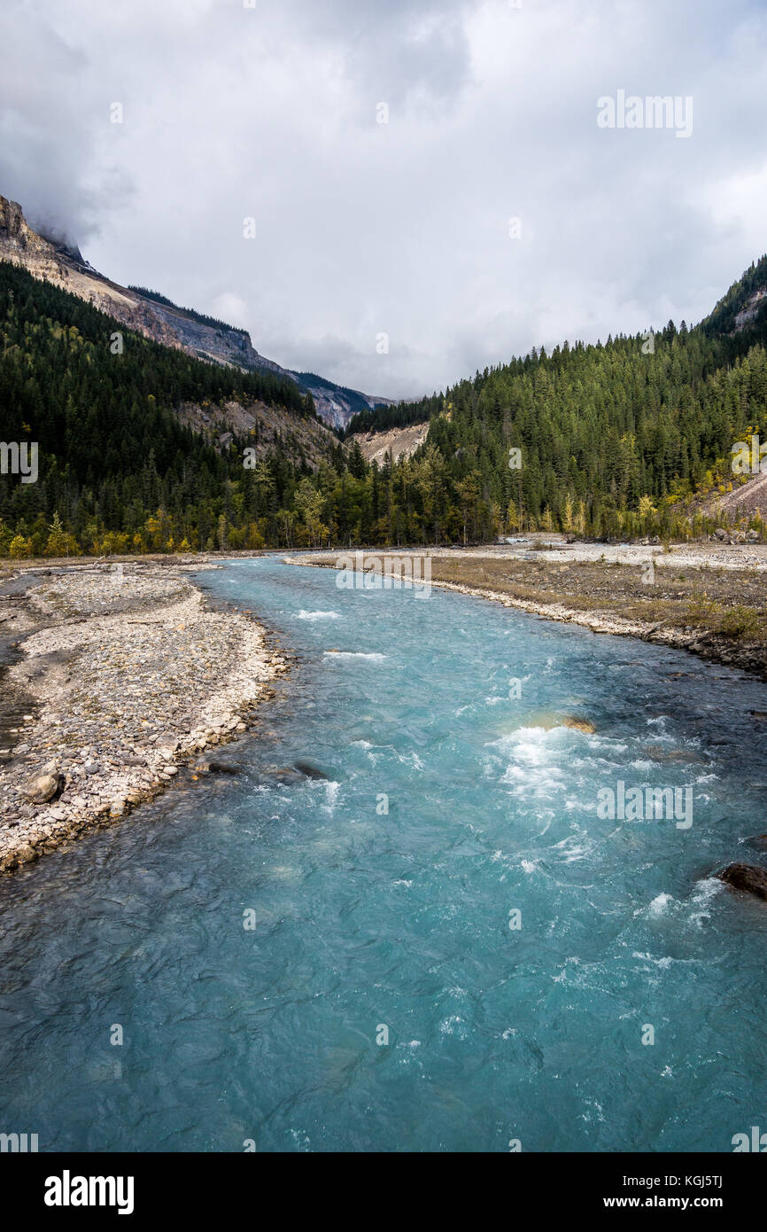Wild And Pristine River Running Down Mountain Valley Stock Photo