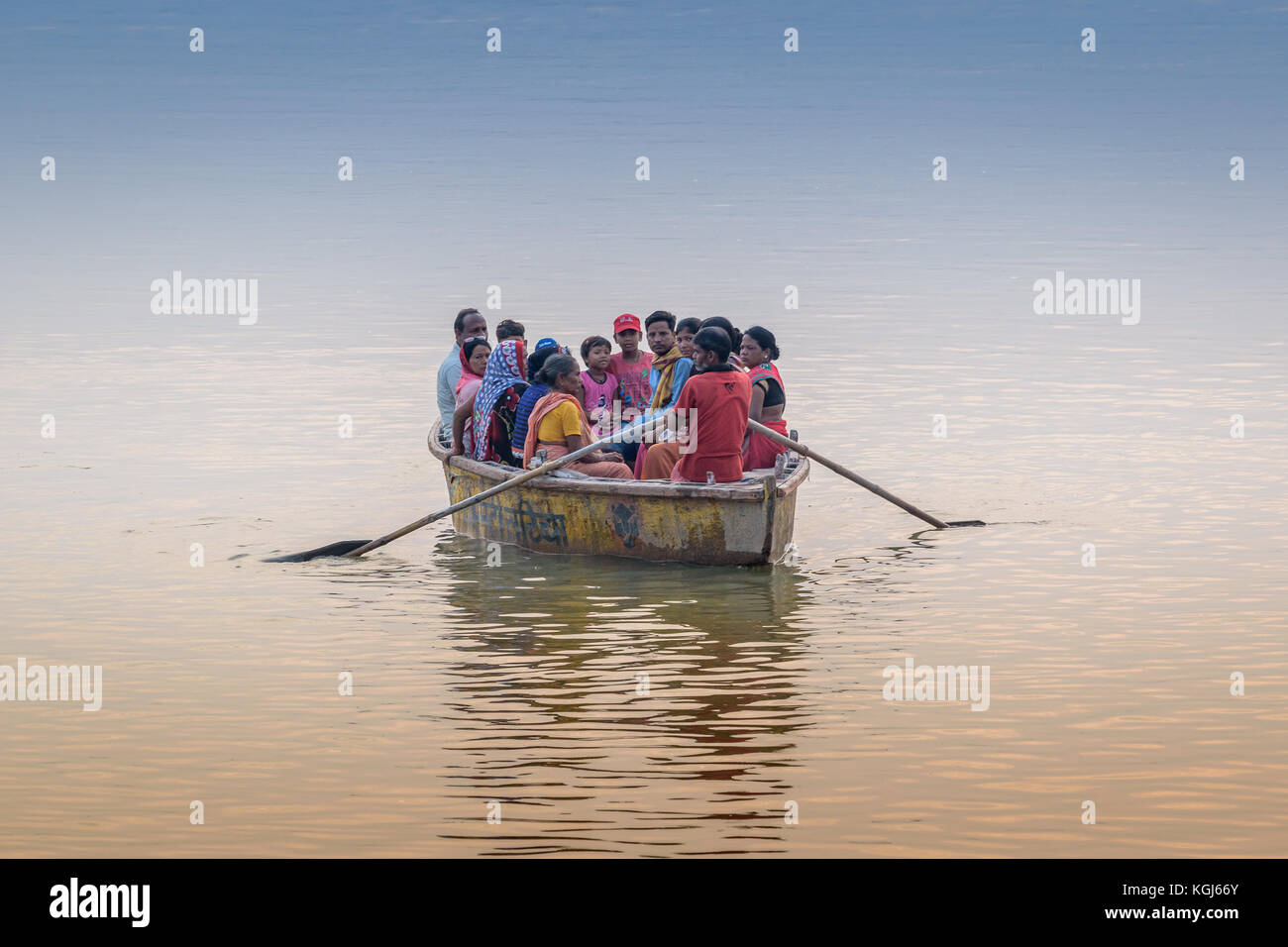 Tourists enjoying early morning boat riding on the River Ganges at Varanasi,Uttar Pradesh,India. Stock Photo