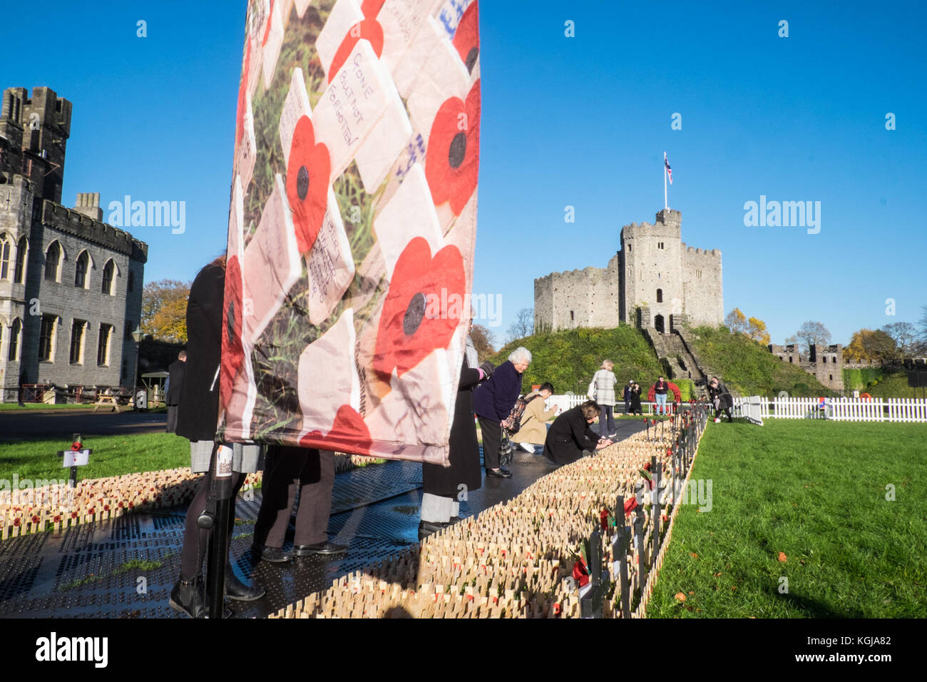 Cardiff, UK. 8th Nov, 2017.The Royal British Legion Field of Remembrance Service held at Cardiff Castle, centre of Cardiff, Wales, UK, on a sunny blue sky but chilly morning.Dignitaries included Secretary of State for Wales, First Minister of Wales, and included dedication and prayers led by The Reverend Canon Stewart Lisk. The official opening of the Cardiff Field of Remembrance took place on Wednesday 8 November at 11am. Credit: Paul Quayle/Alamy Live News Stock Photo