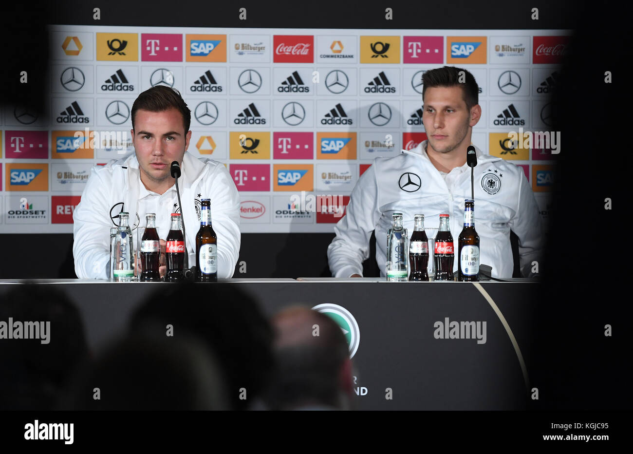 Berlin, Germany. 8th Nov, 2017. Niklas Suele and Mario Goetze answering journalists' questions during the German national soccer squad's press conference in before their game versus England the Mercedes World in Berlin, Germany, 08 November 2017. Credit: Action Plus Sports Images/Alamy Live News Credit: Action Plus Sports/Alamy Live News Stock Photo