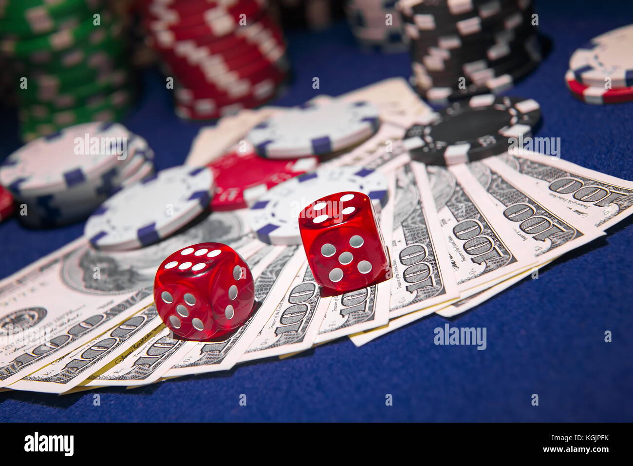 Stack of Poker chips with dice rolls on a dollar bills, Stock Photo