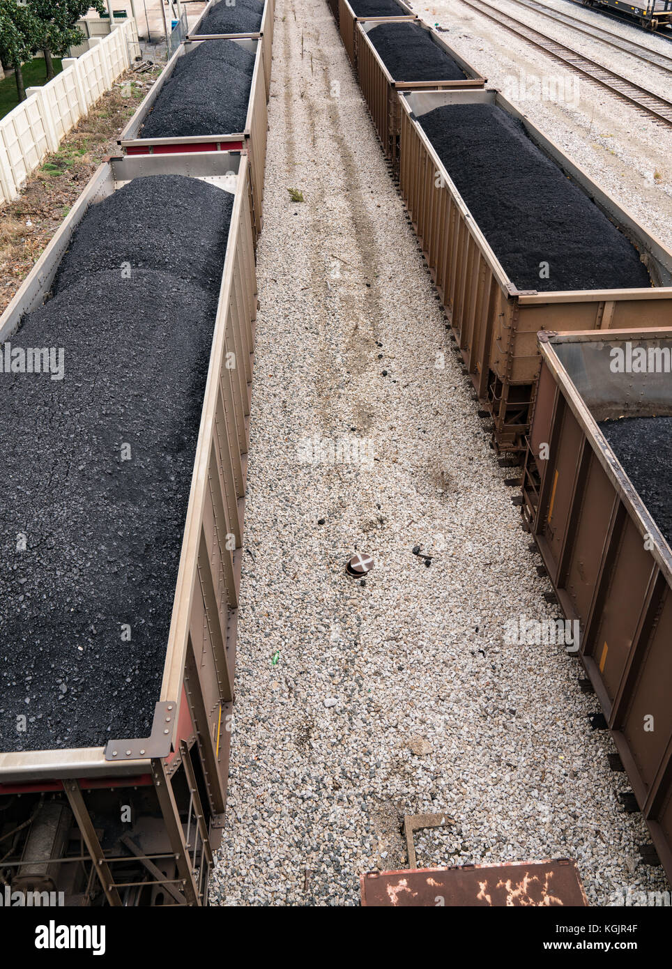 Train cars loaded with coal in rail yard Stock Photo