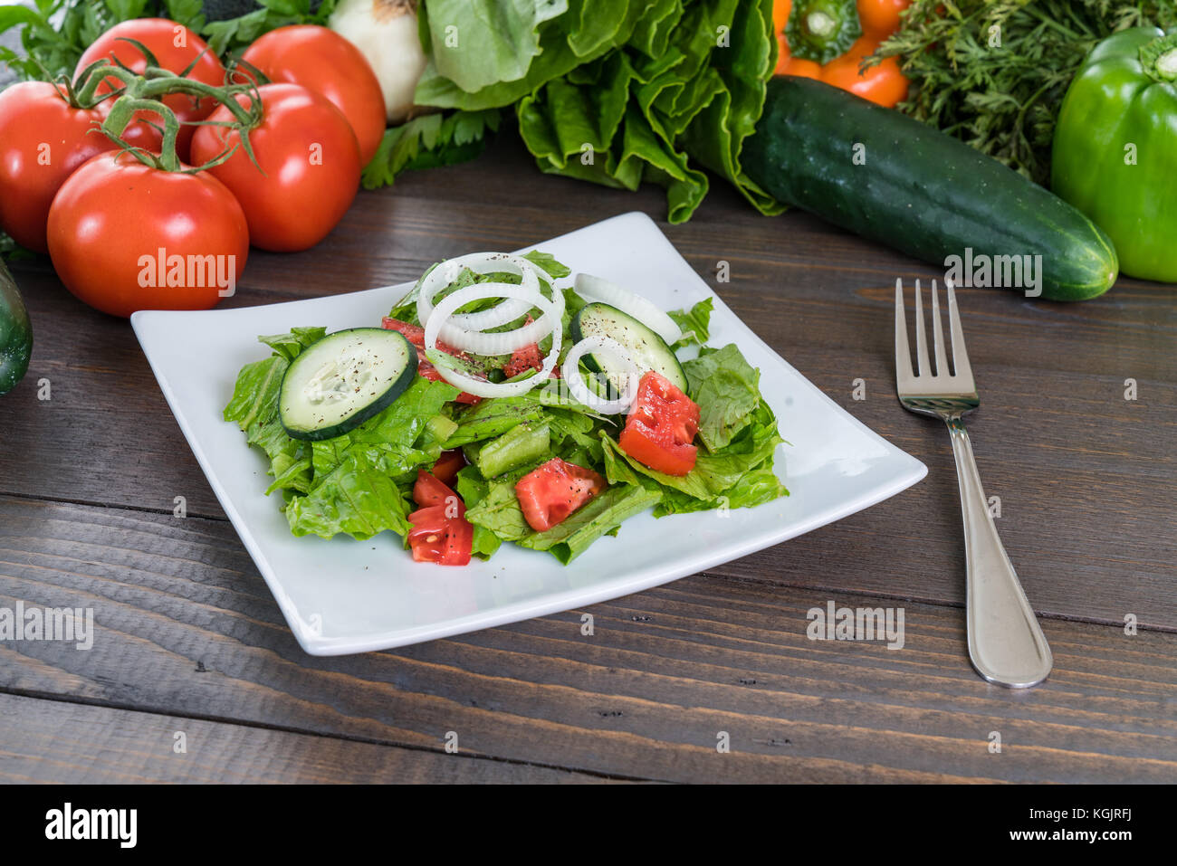 Fresh salad on wood table with vegetables Stock Photo