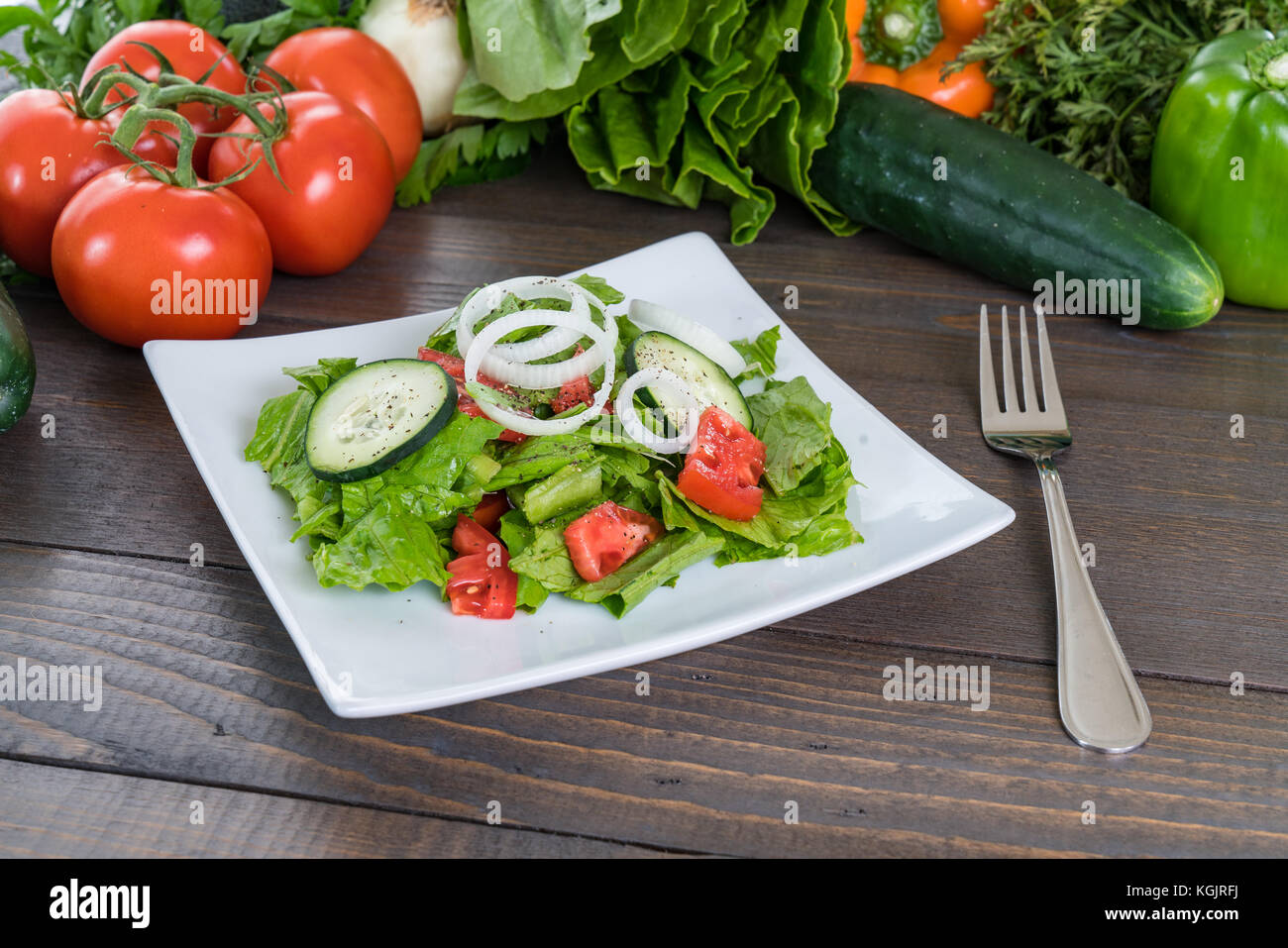 Fresh salad on wood table with vegetables Stock Photo - Alamy