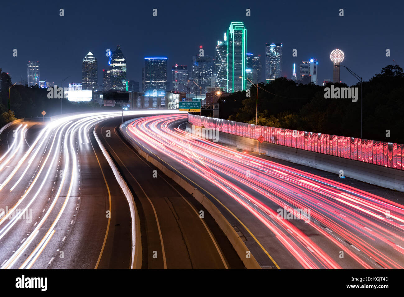 Dallas, Texas city skyline at Night with traffic light trails Stock