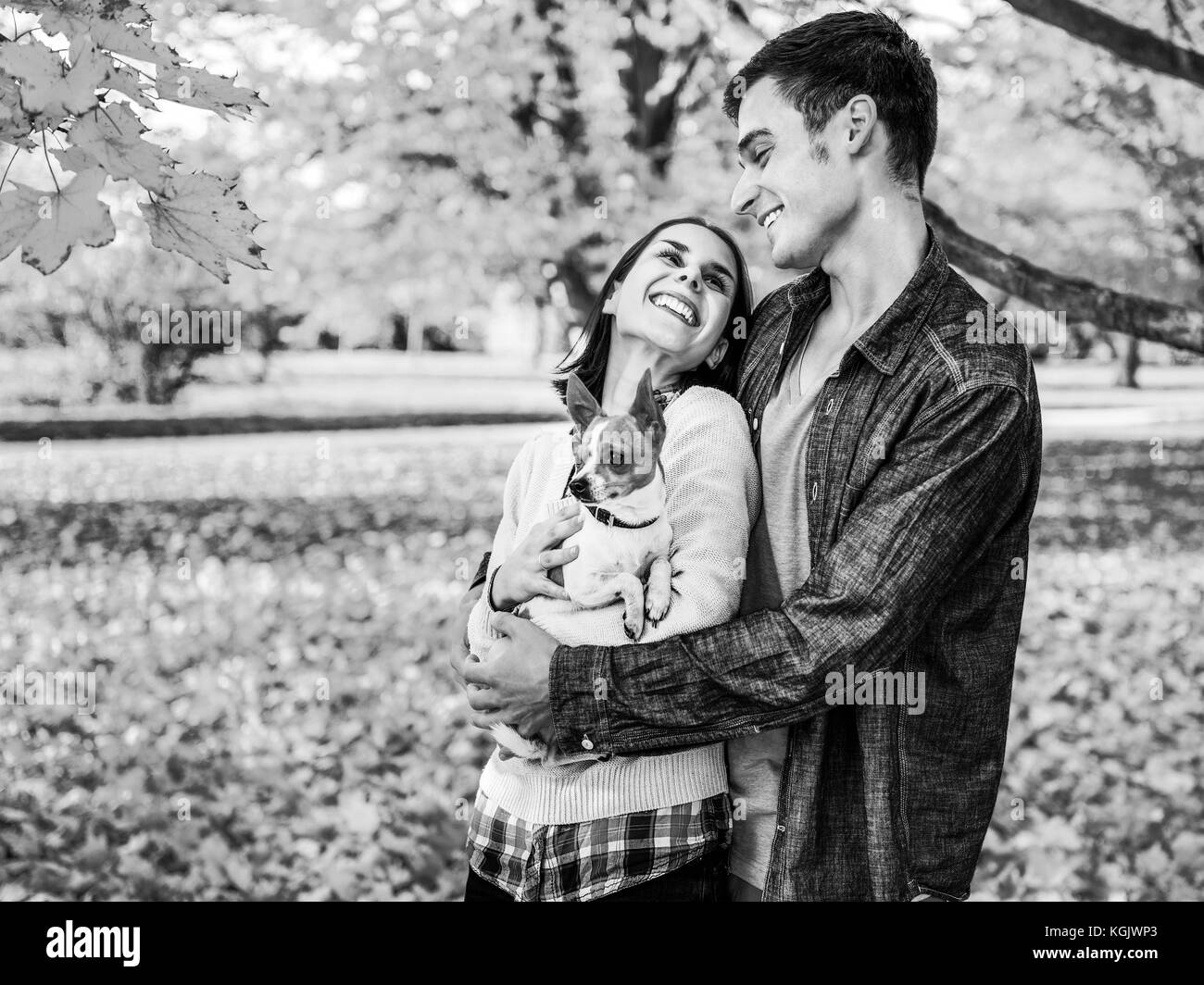 Portrait of happy young couple outdoors in autumn Stock Photo - Alamy