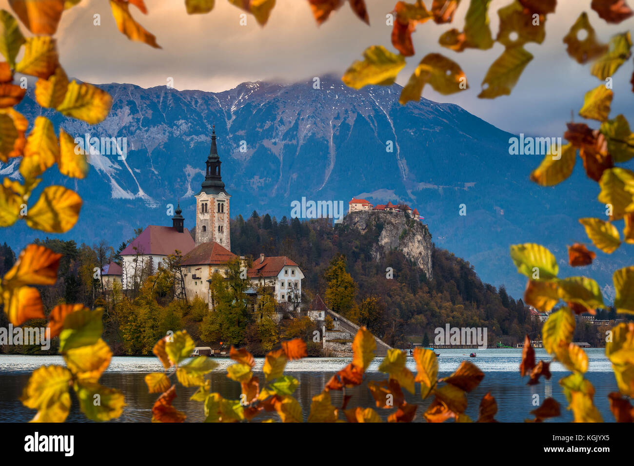Bled, Slovenia - Beautiful autumn sunrise at Lake Bled with the famous Pilgrimage Church of the Assumption of Maria with Bled Castle and Julian Alps a Stock Photo