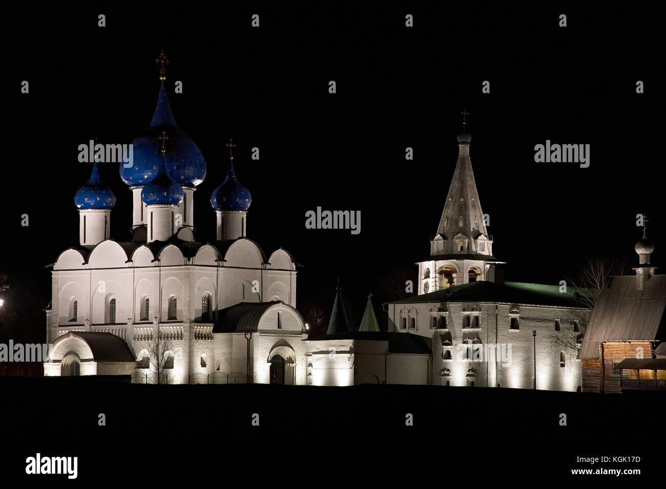 The night landscape of Suzdal. Night shooting of a white-stone Orthodox church. Nearby is the bell tower of the Suzdal Kremlin.Suzdal.Golden Ring Stock Photo
