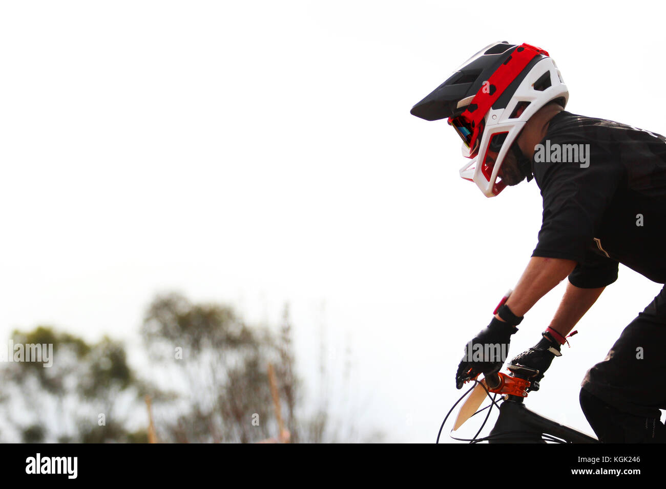 Horizontal photo of a male enduro rider  facing left during a enduro mountain bike race Stock Photo