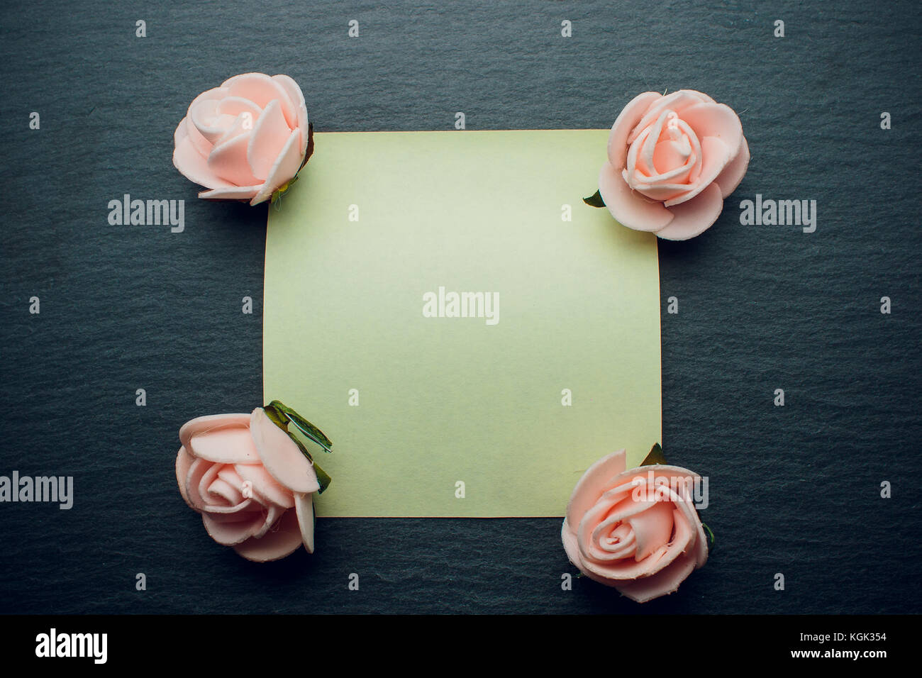 petals around the rose note paper on black background Stock Photo Alamy