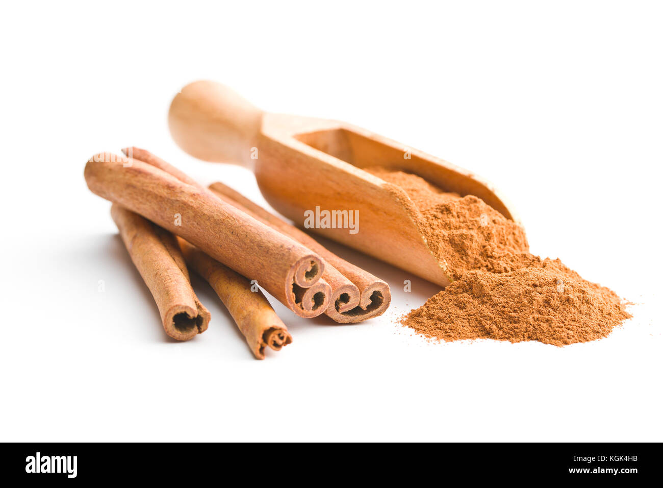 Cinnamon sticks and milled cinnamon isolated on white background. Stock Photo