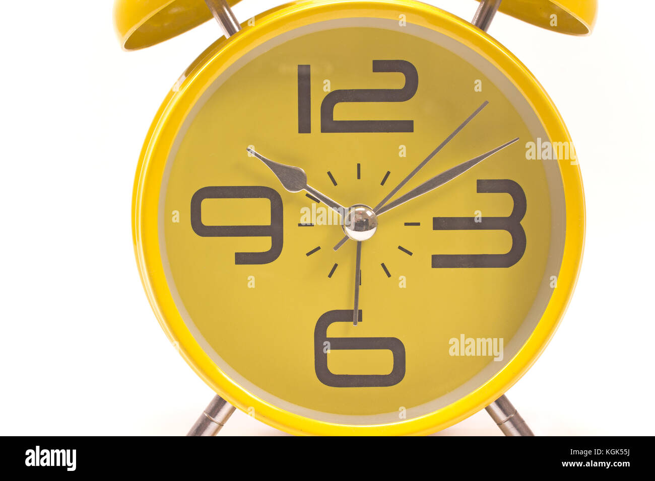 Yellow alarm clock close up isolated on white Stock Photo - Alamy